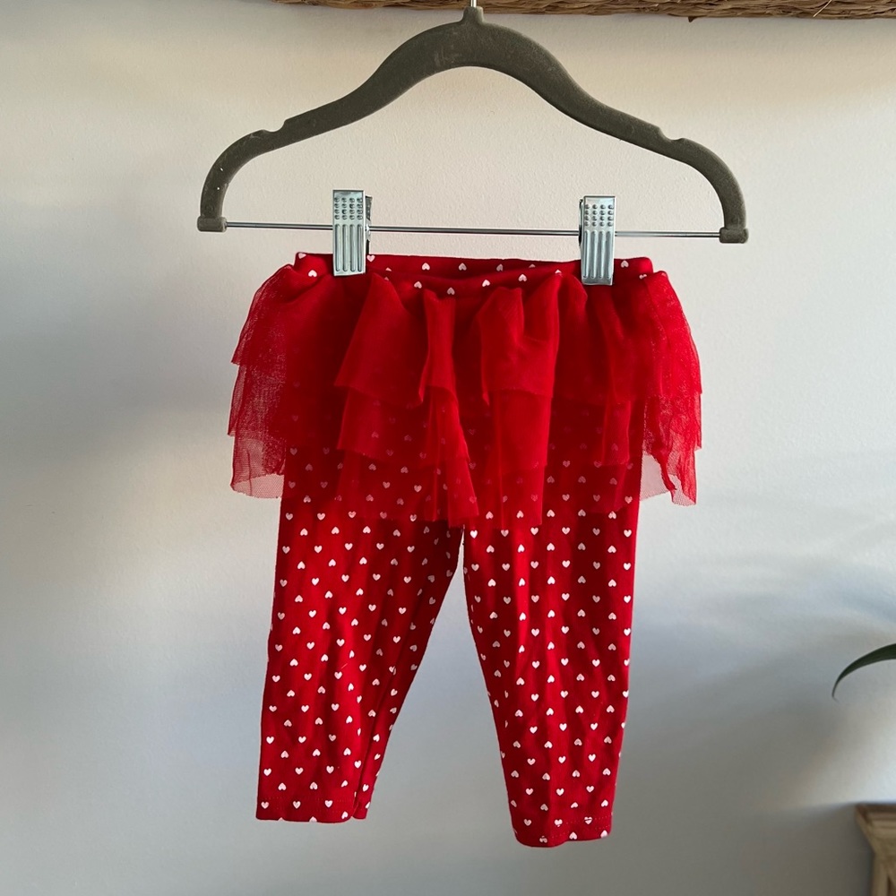 Carter’s red leggings with white harts for 6m girl.